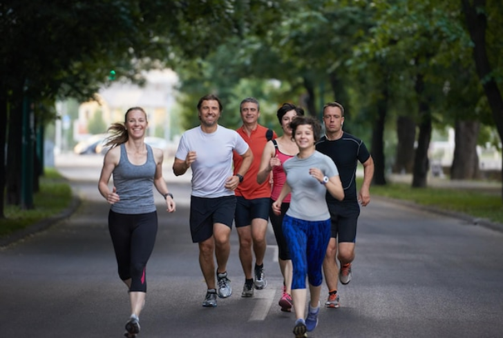 People jogging in morning sunlight