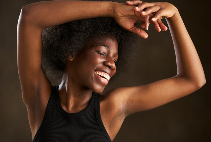 Smiling Kenyan woman after surgery