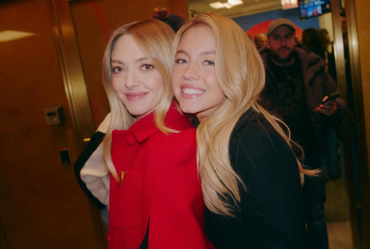 Sydney Sweeney and Amanda Seyfried laughing