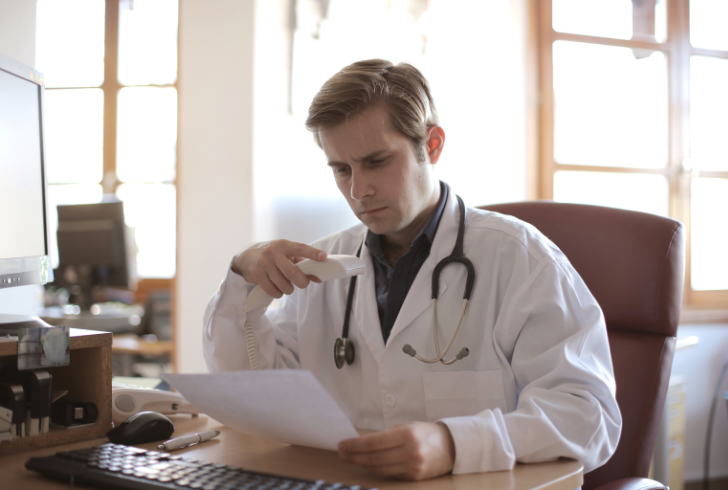 Doctor reviewing legal medical documents