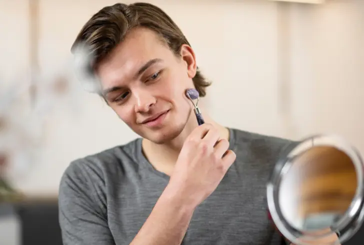 Young man following beauty trends