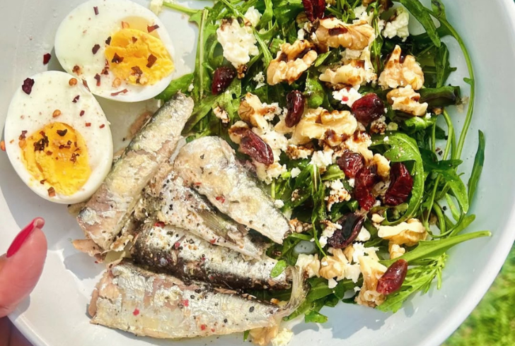 Healthy sardines meal with vegetables and eggs